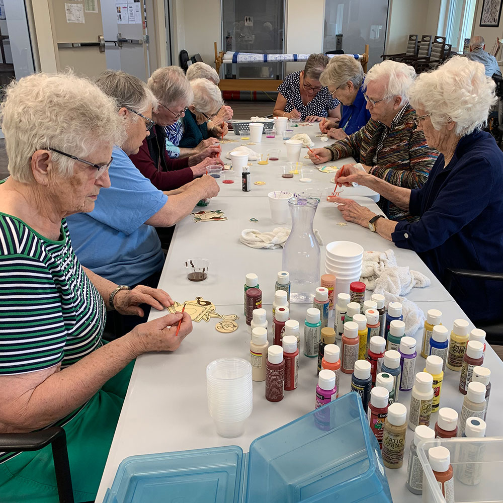 A group of women crafting at Kinsmen Kourts II in Neepawa, Manitoba.